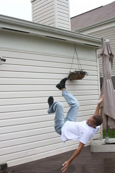 man falling off a roof