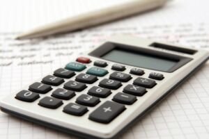 A calculator, pencil and paper